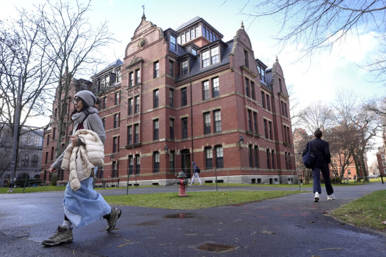 People walk on campus at Harvard University