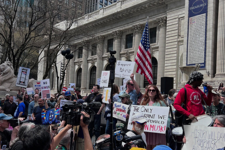 People gather to protest President Donald Trump's policies on Saturday, April 19, 2025 in New York.