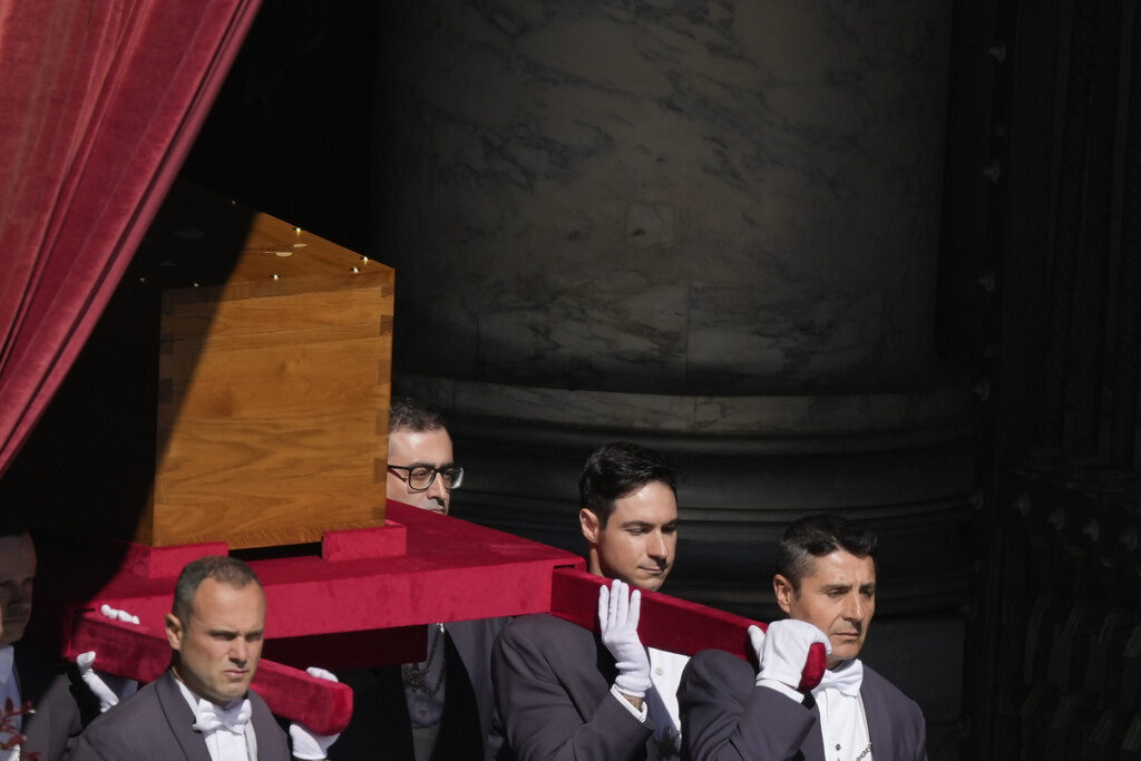 Men carry the coffin of Pope Francis