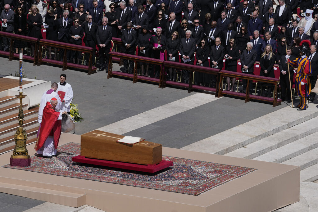 Pope Francis is wheeled through the Vatican in a coffin in front of a crowd