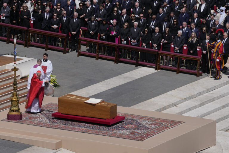 Pope Francis is wheeled through the Vatican in a coffin in front of a crowd