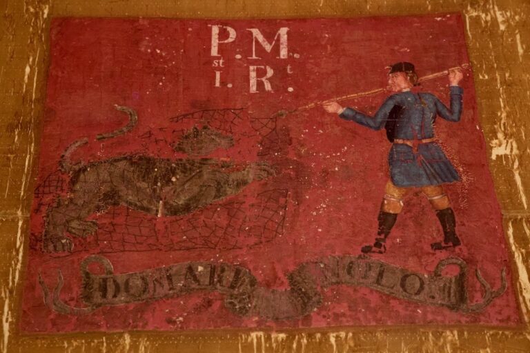 The flag of the 1st Continental Regiment on display at the Museum of the American Revolution