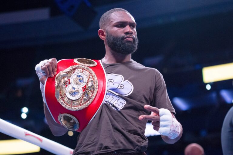 Jaron Ennis holding his championship belt