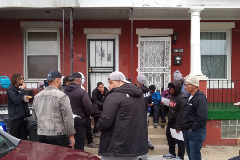 the team speaking together outside