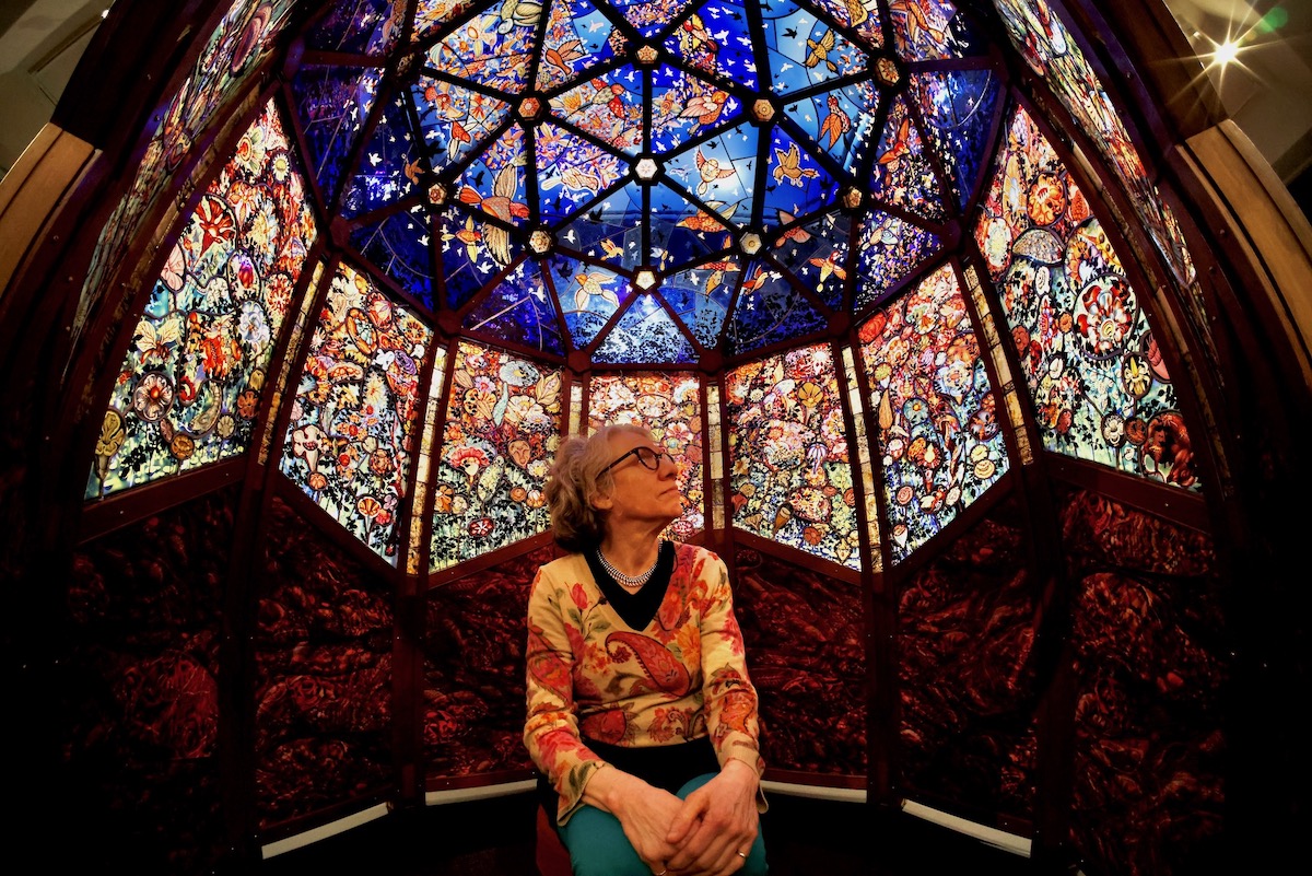 Judith Schaechter sits inside her dome