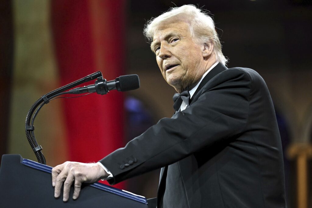 Trump Donald Trump speaking at a podium