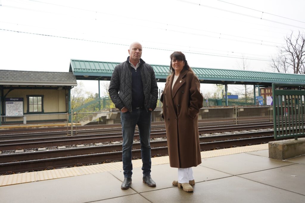Ken Kearns and Lisa Borowski posing on the platform at at the train station