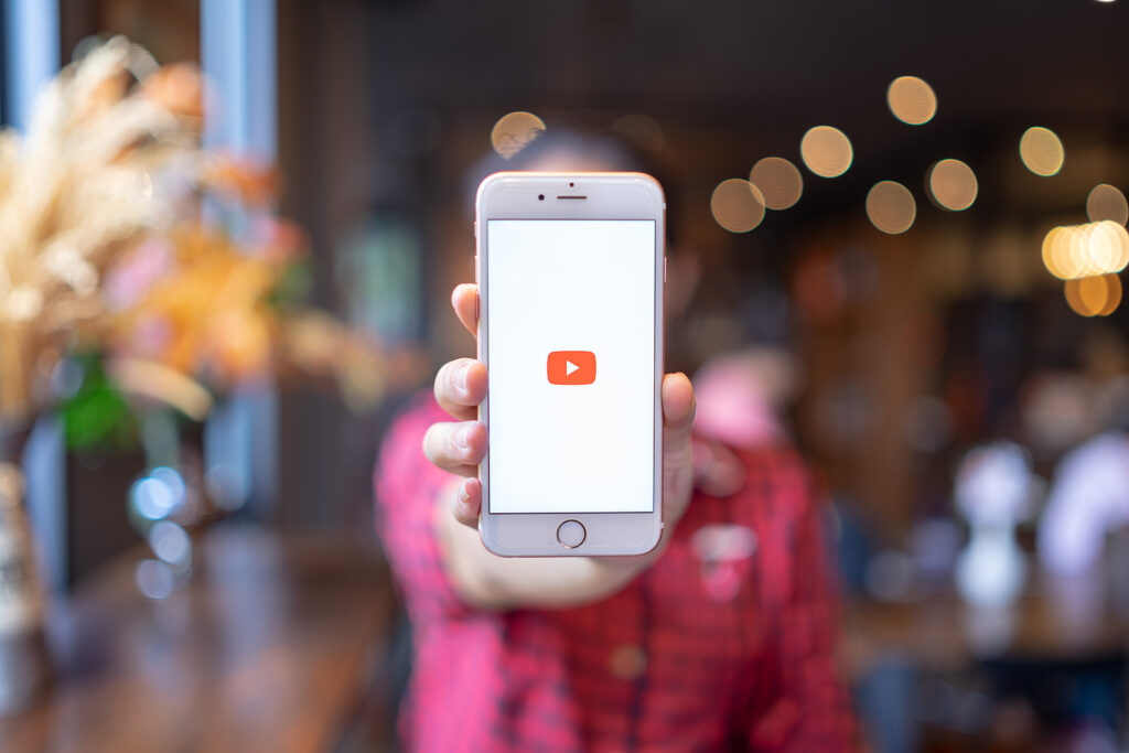 CHIANG MAI, THAILAND - Apr.08,2019: Woman holding Apple iPhone 6S Rose Gold with Youtube apps on screen. YouTube is the popular online video sharing website.