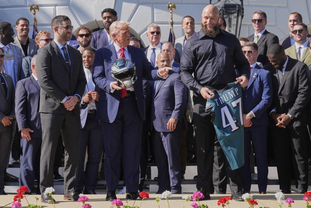 Lane Johnson presents Donald Trump with an Eagles Jersey with his name on it at the White House ceremony
