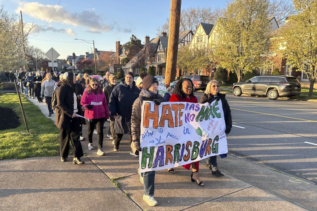 Shapiro Arson Antisemitism People walk during a march and prayer vigil in Harrisburg, Pa.