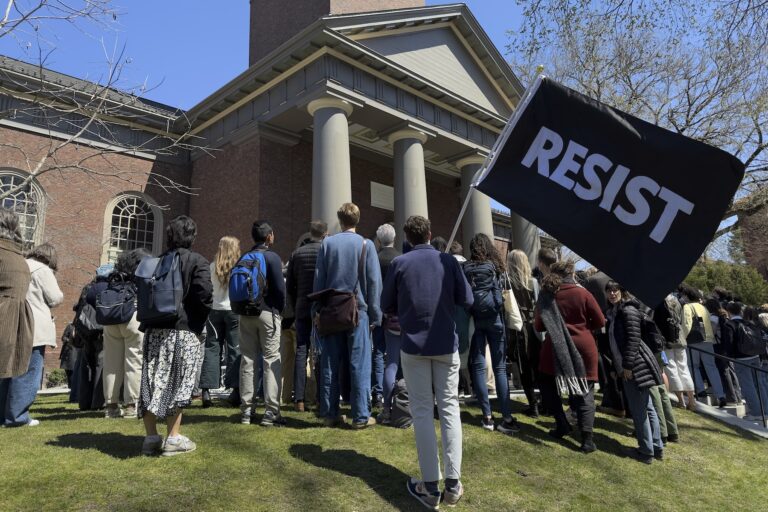 Students, faculty and members of the Harvard University community rally