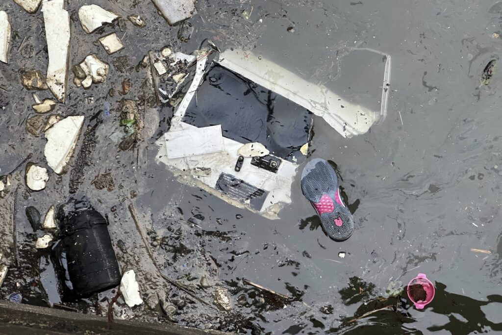 NYC Helicopter Crash Debris floats in the water