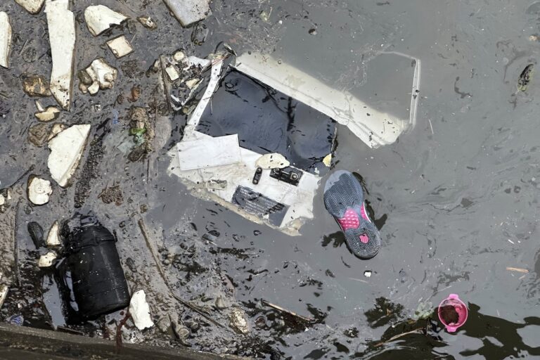 Debris floats in the water