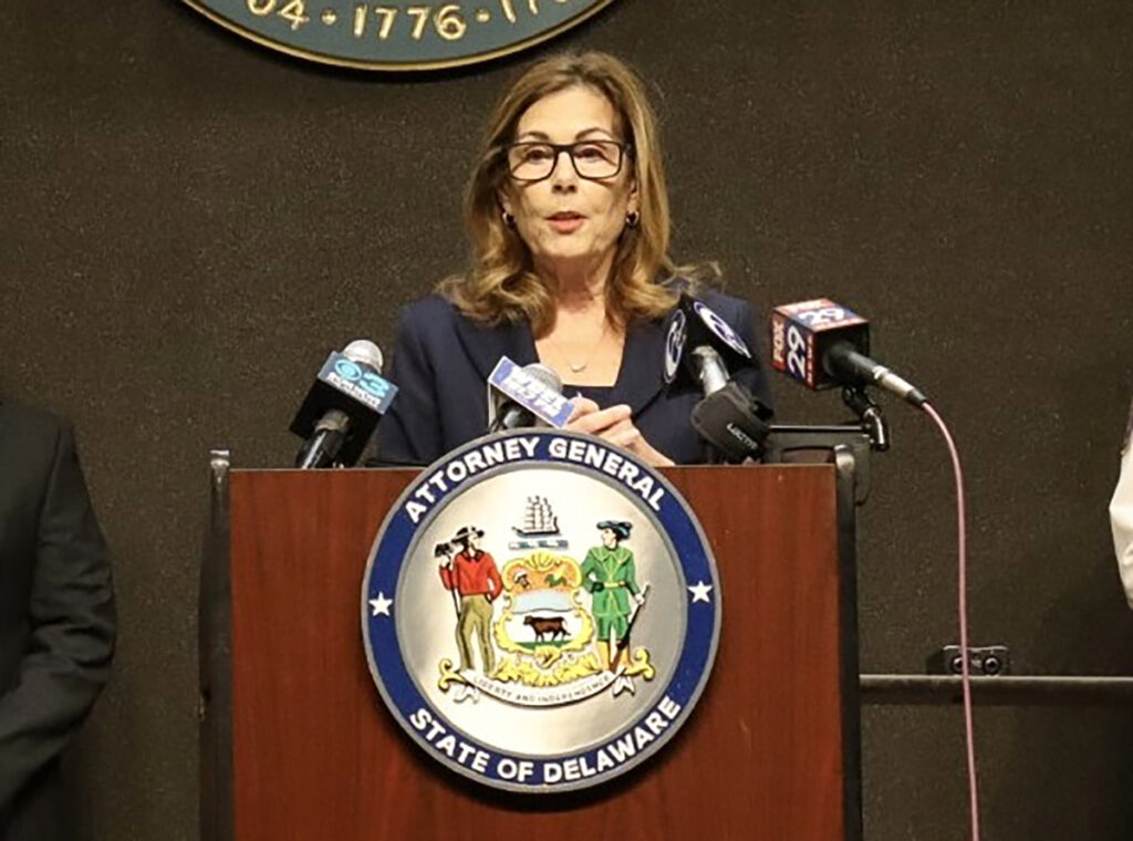 Kathy Jennings speaking at a podium