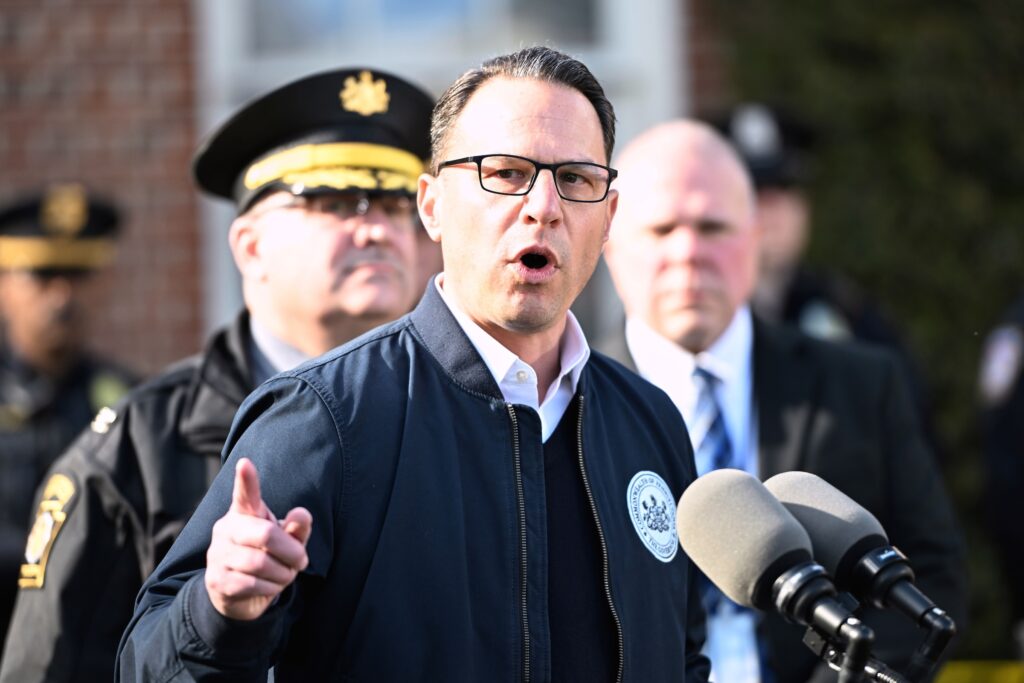 Pennsylvania Governor-Arson Josh Shapiro speaking at a podium
