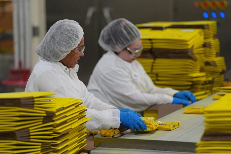 two workers packaging