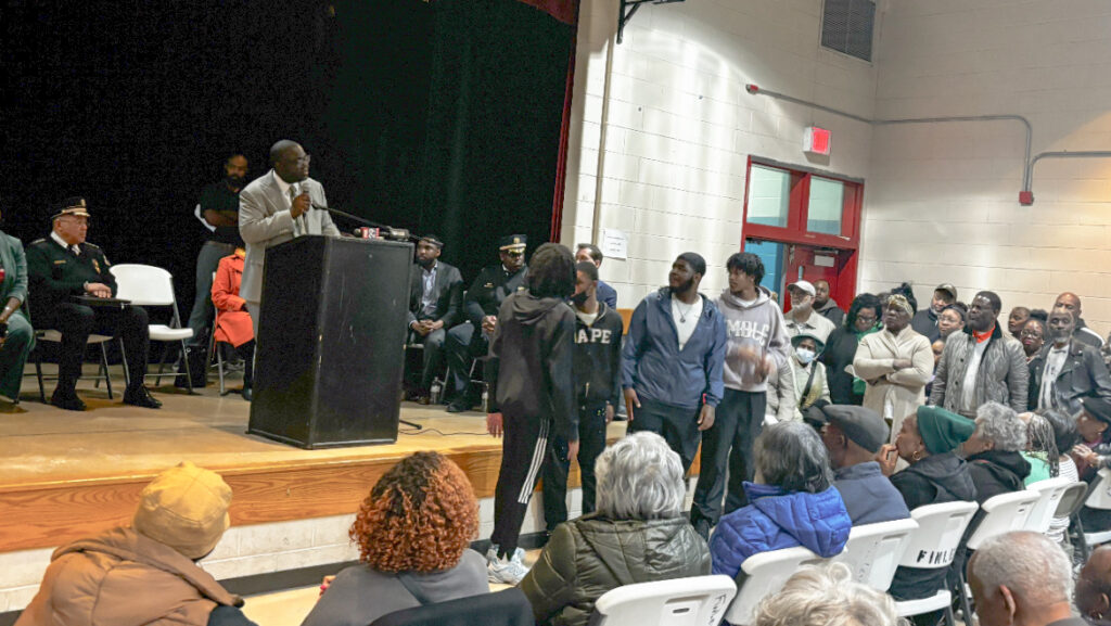 Anthony Phillips addressing a room full of people