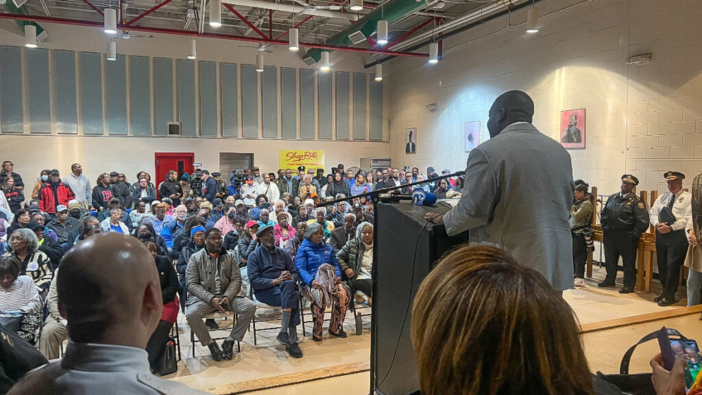 Anthony Phillips addressing a room full of people
