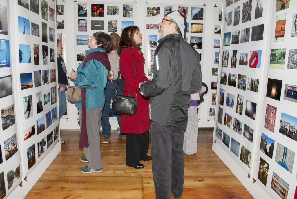 philly-photo-day-2025-04-02 People admiring photographs at an exhibition