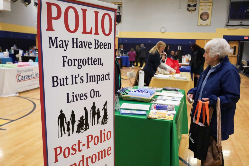 Members of the Post Polio Network volunteer at a health and disability fair in New Hope, Pa.
