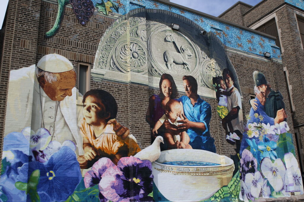 pope-francis-murals-philadelphia-CS-042425-01 Close up view of mural on the facade of Saint Malachy School