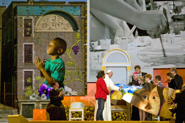 Pope Francis signing mural during visit to Philadelphia