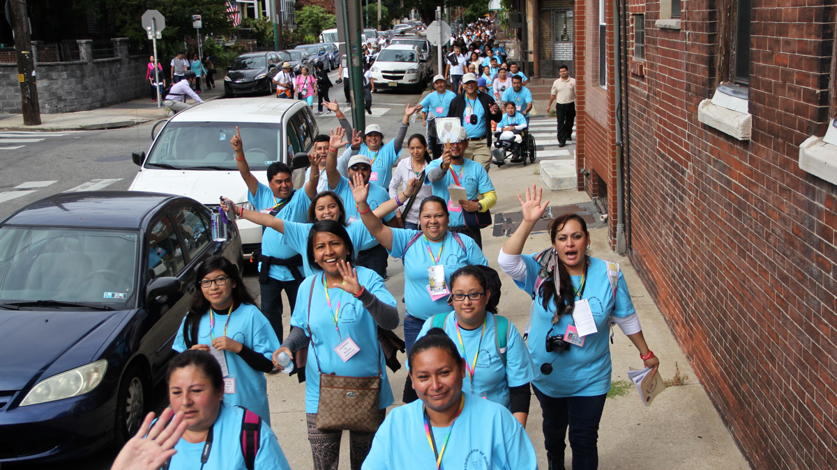 people waving to the camera