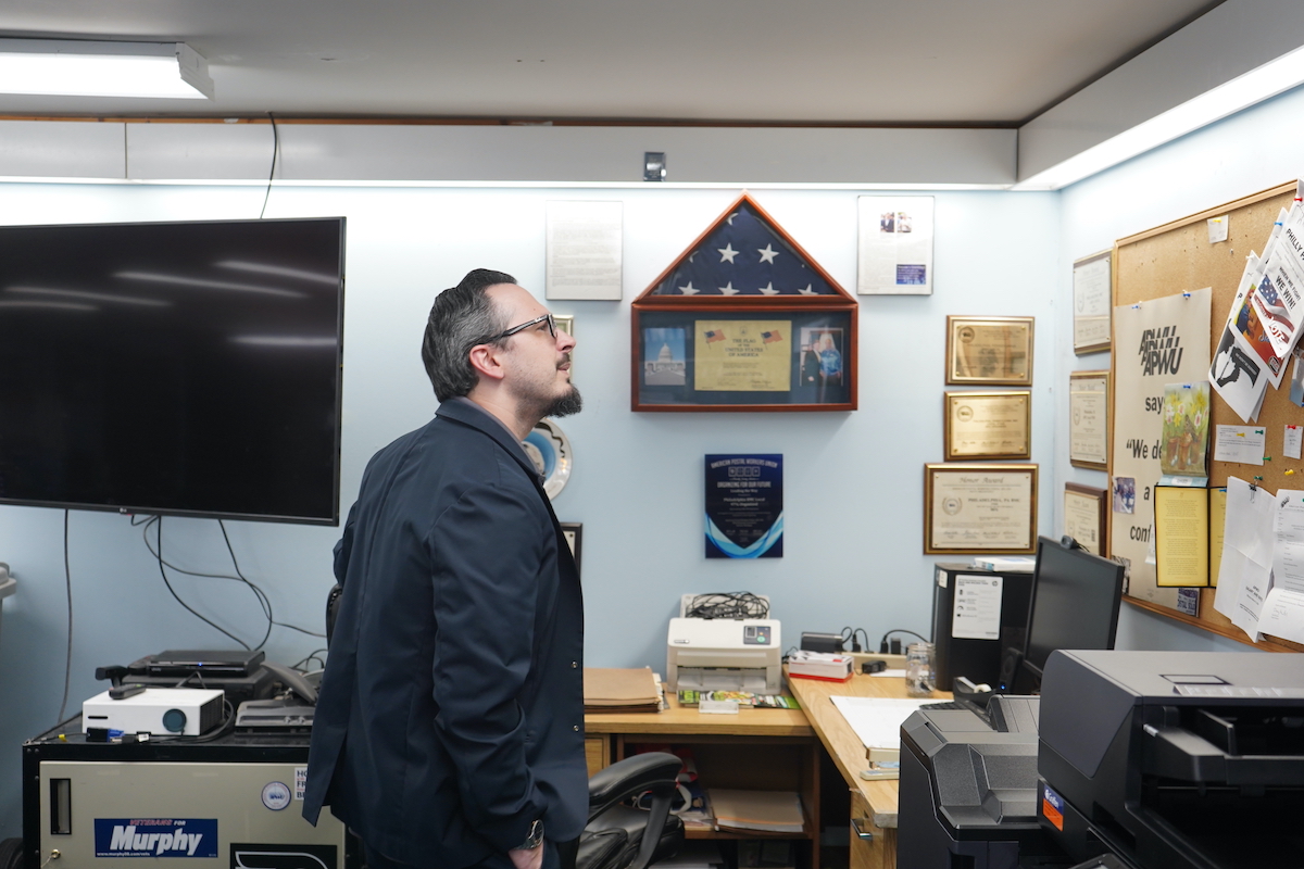James DeRidder standing in postal workers union office