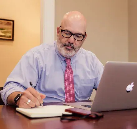 Thomas Jones working on his computer at a desk