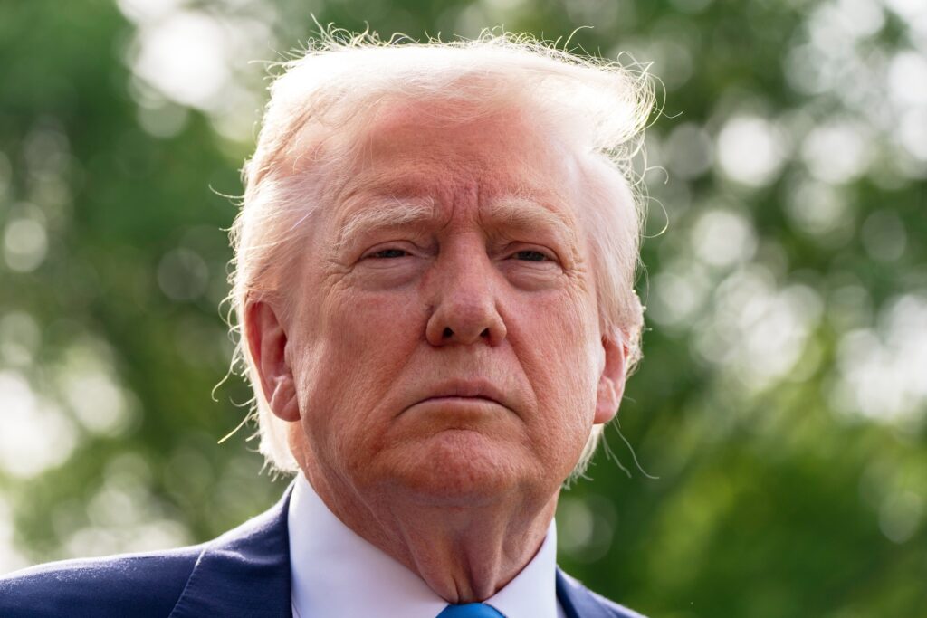 President Donald Trump speaks with reporters