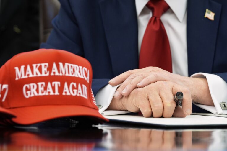President Donald Trump speaks with reporters