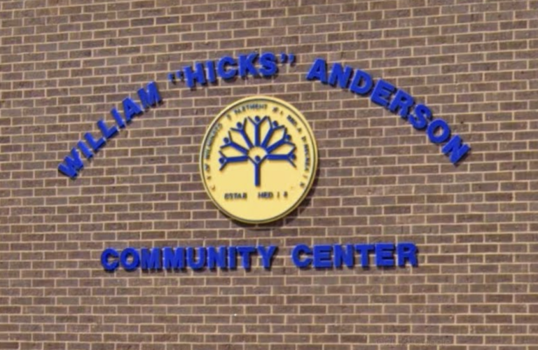 The sign on the exterior of the community center