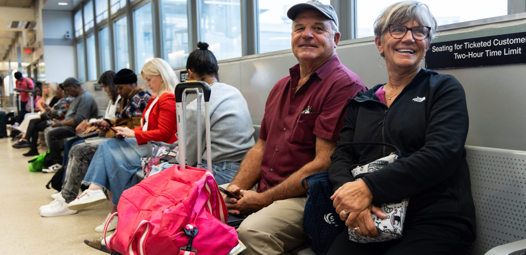 Dave and Lynda Collins sitting in an NJ Transit station