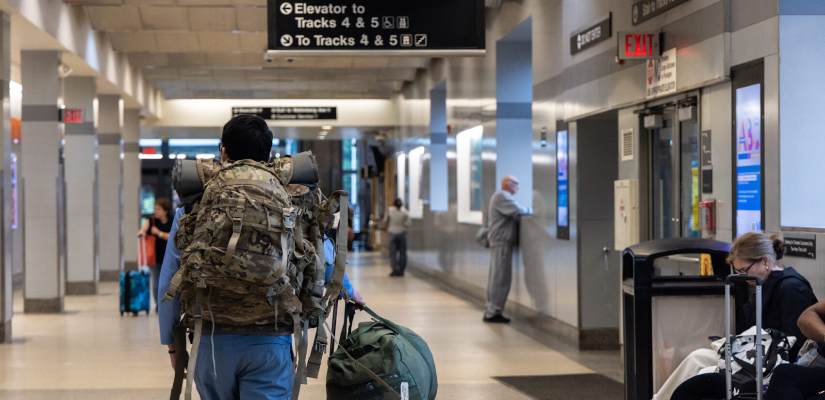 Passengers wait for Amtrak trains at the Trenton Transit Center
