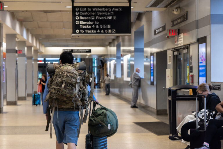 Passengers wait for Amtrak trains at the Trenton Transit Center