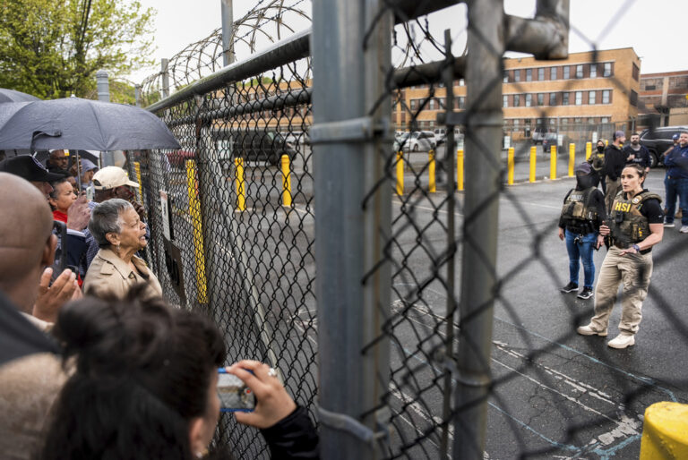 Rep. Bonnie Watson Coleman, D-N.J., speaks with an officer demanding she be let into the ICE Detention office