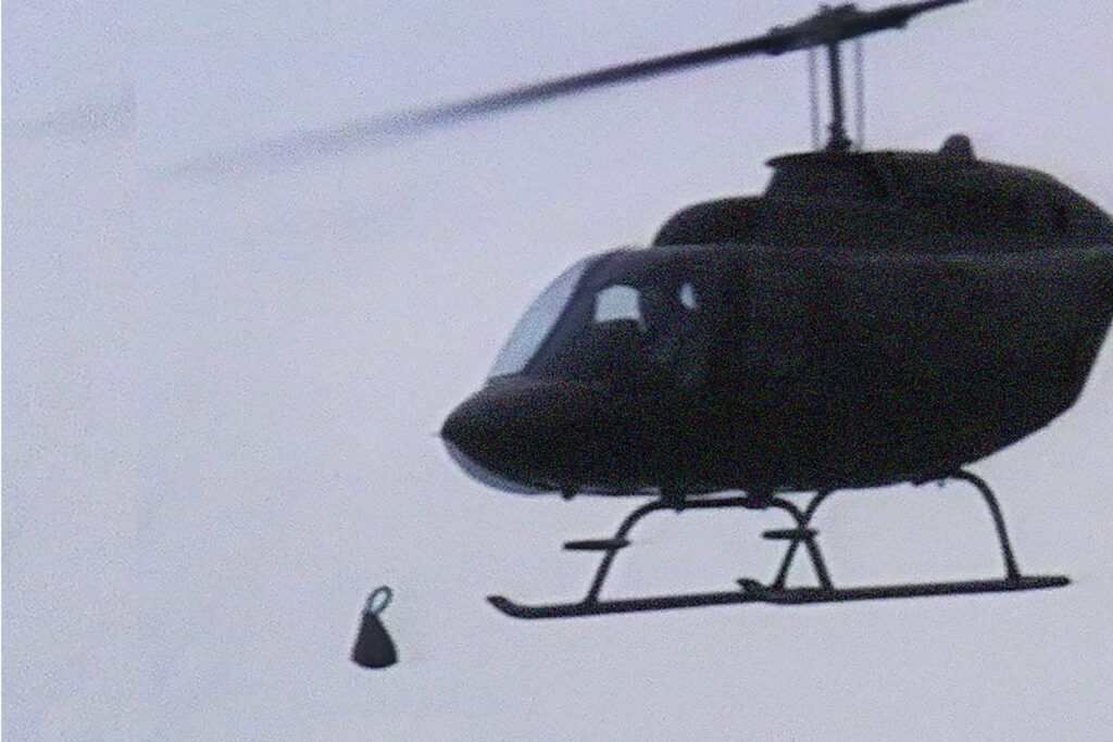 a helicopter drops a bomb