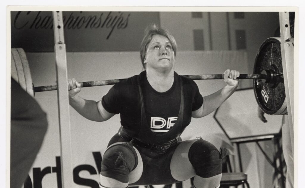 STRONGER_Illustration_Ch5_2_JanTodd_Squatting_600dpi Jan Todd squatting at the U.S. Powerlifitng Federation Women’s Nationals in Los Angeles, in 1980 (Photo by Kathy Tuite Leistner)