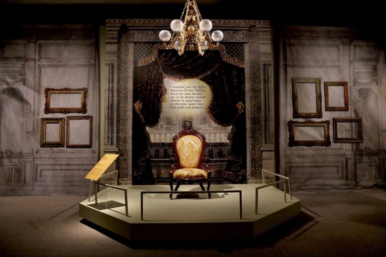 Chair and display in 'Almost Unknown: The Afric-American Picture Gallery exhibit
