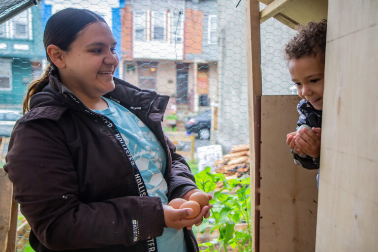 Maria Alaya and Nicholas at their chicken farm
