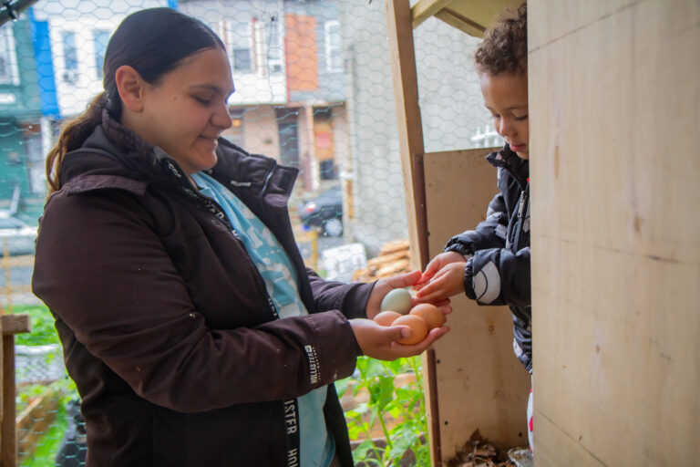 Maria Alaya and Nicholas at their chicken farm