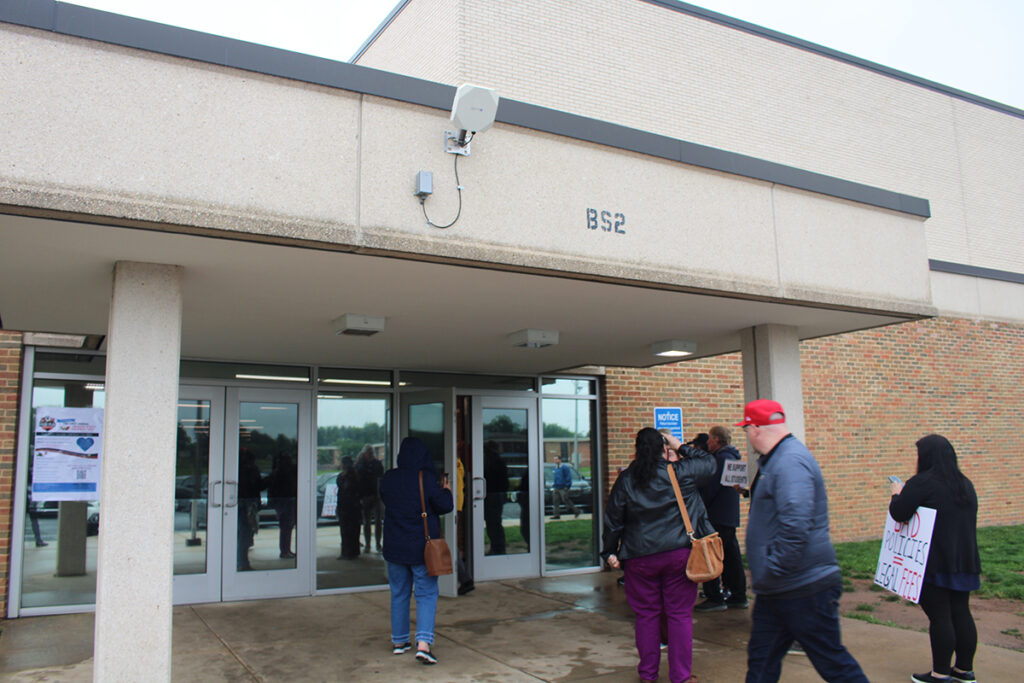 Parents walking to a Centennial School District forum