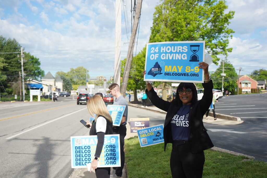 delco-gives-day-2025-05-08-3 Delco Gives Day volunteers hold signs for the event