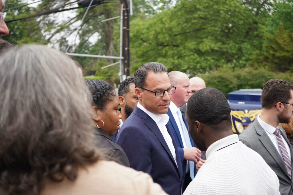 Gov. Josh Shapiro shakes hand with Delaware County officials