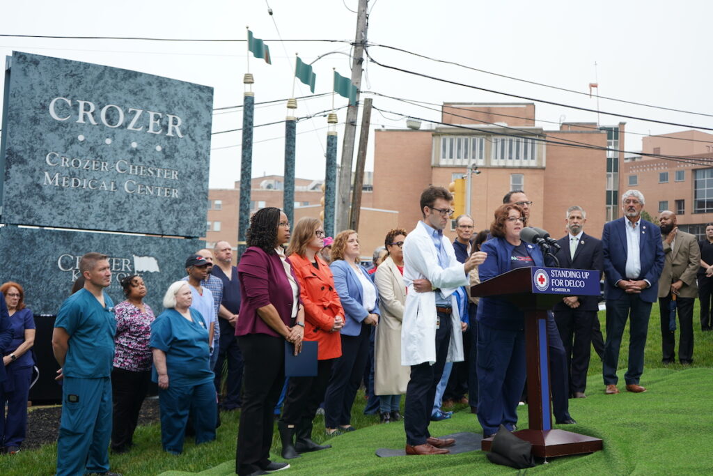 Dr. Max Cooper and nurse Peggy Malone with elected officials outside Crozer-Chester Medical Center