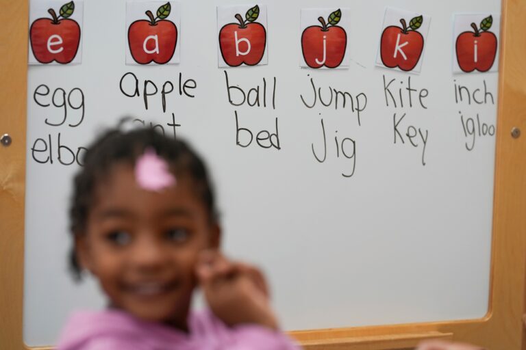 A student participates in a reading and writing lesson at a Head Start program in Florida