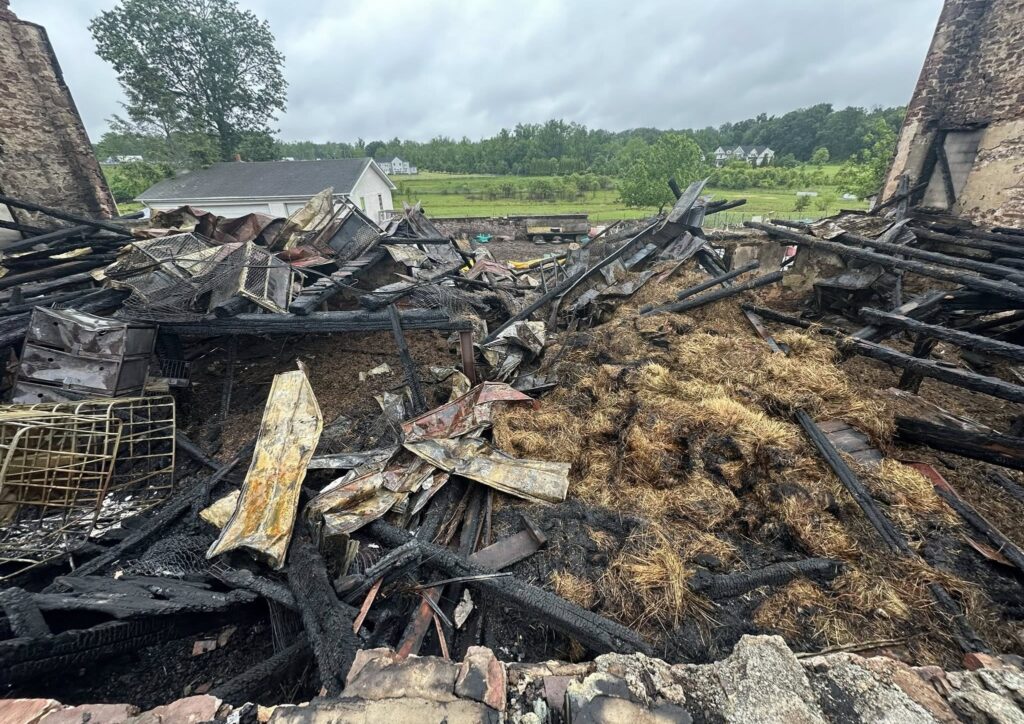 house-of-wiggle-goats-fire-2025-05-29 A heavily damaged barn after a fire
