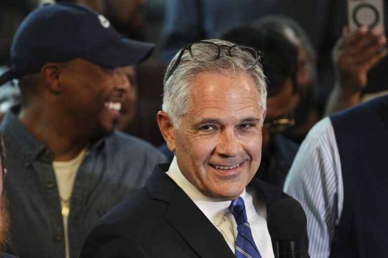 Larry Krasner smiling after winning the primary election
