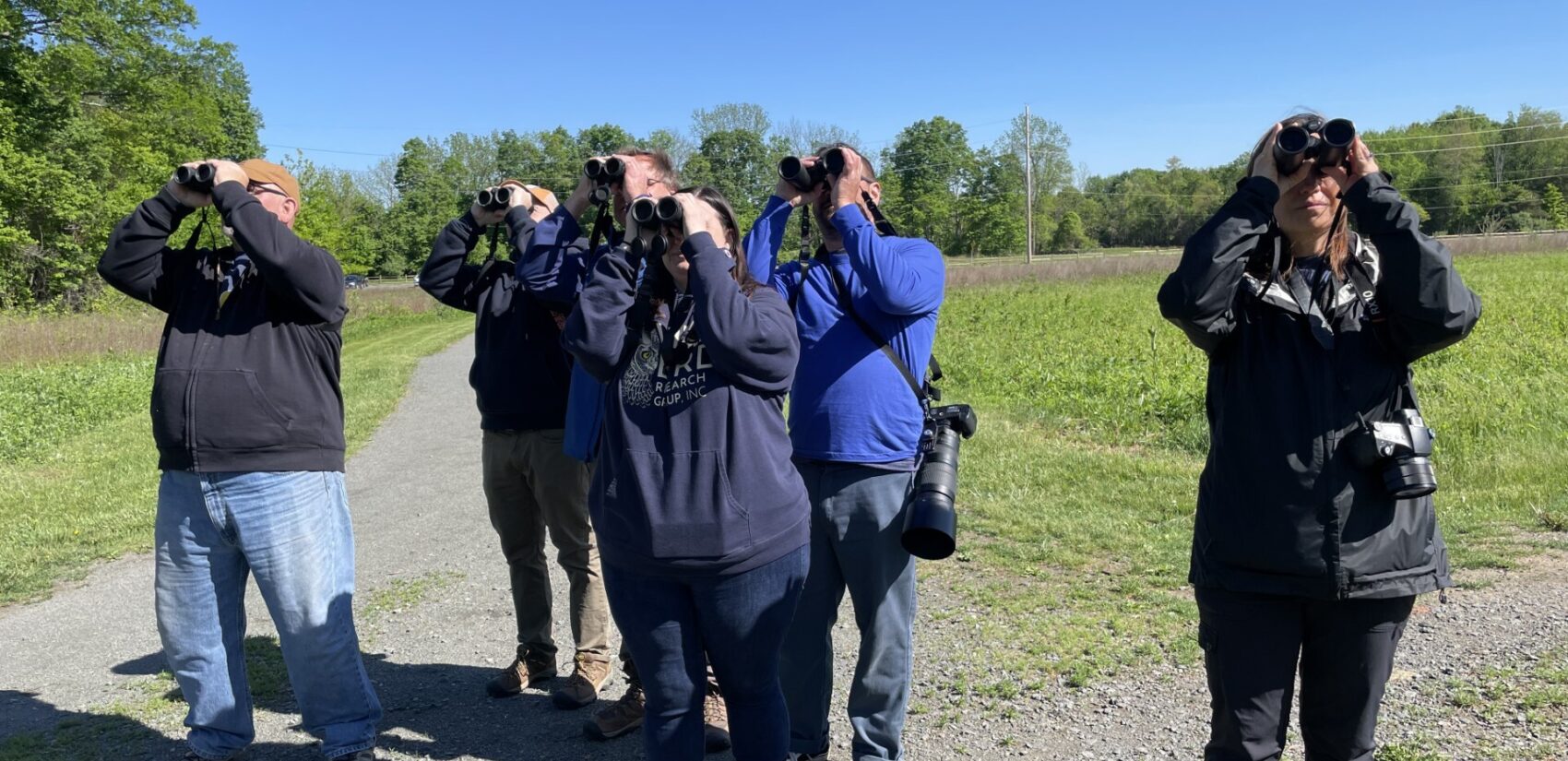 The Birders of Central New Jersey at the World Series of Birding looking through binoculars
