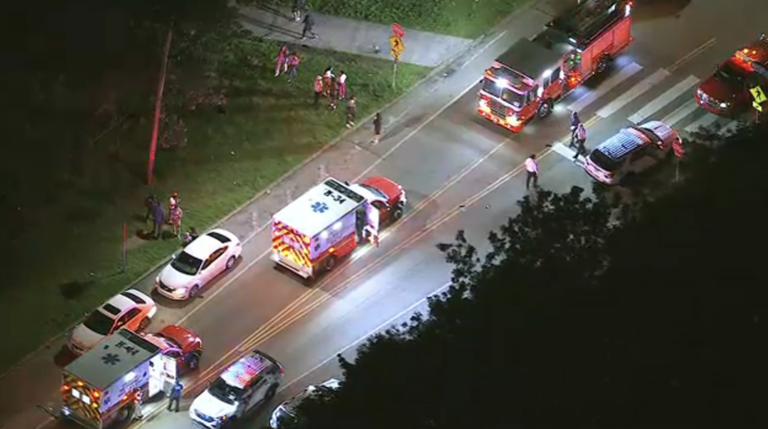 Police are seen on the scene of a mass shooting in Fairmount Park